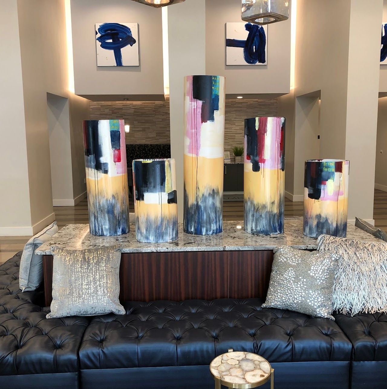3D cylinder art installation by Joanna Purvis in a commercial lobby