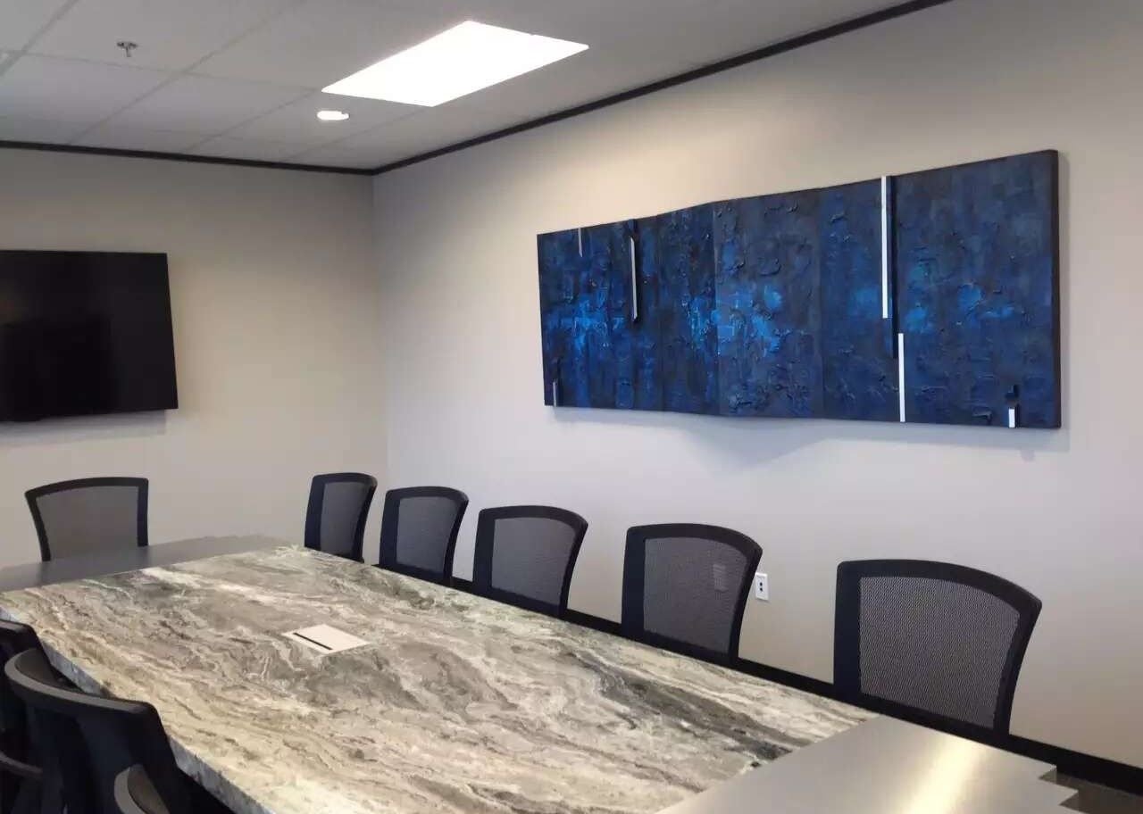 Blue triptych by Joanna Purvis in a corporate boardroom