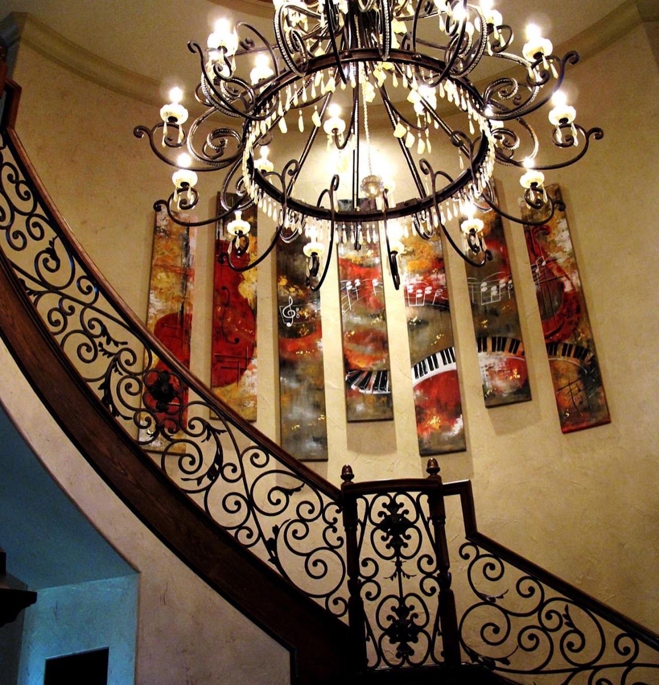 Music themed panel installation by Joanna Purvis along a curved staircase