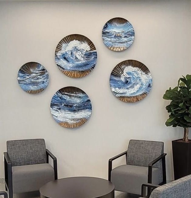 Wave paintings on round metal plates by Joanna Purvis