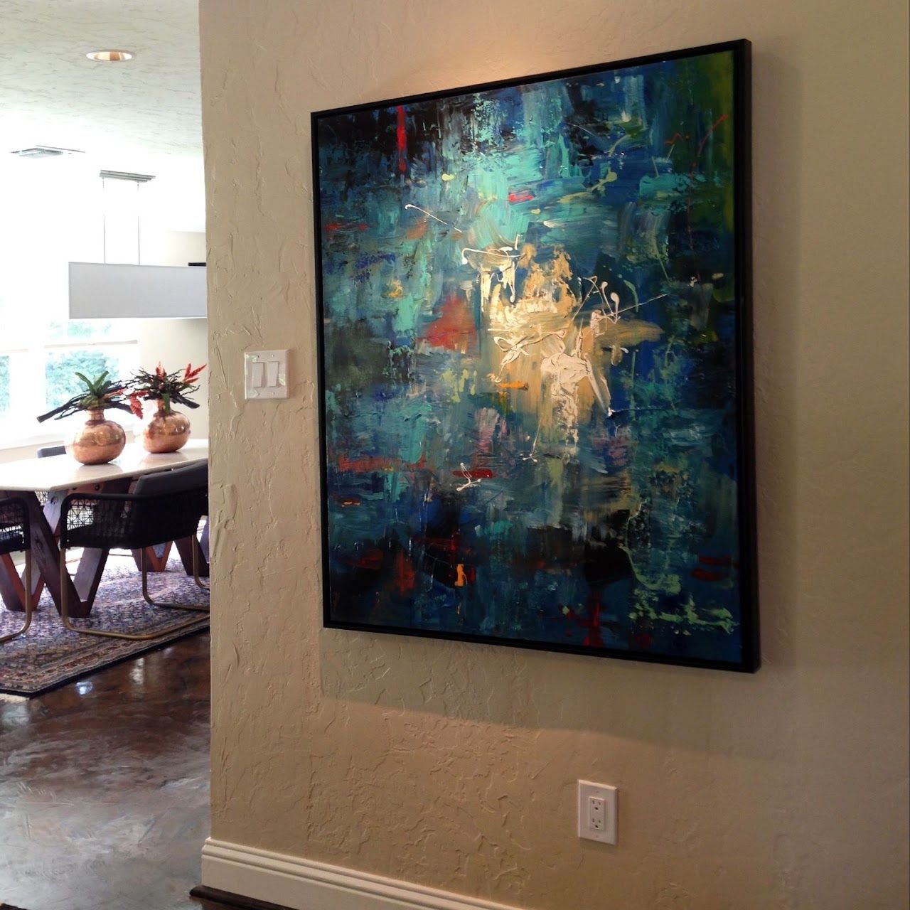 Teal abstract painting by Joanna Purvis in a dining room