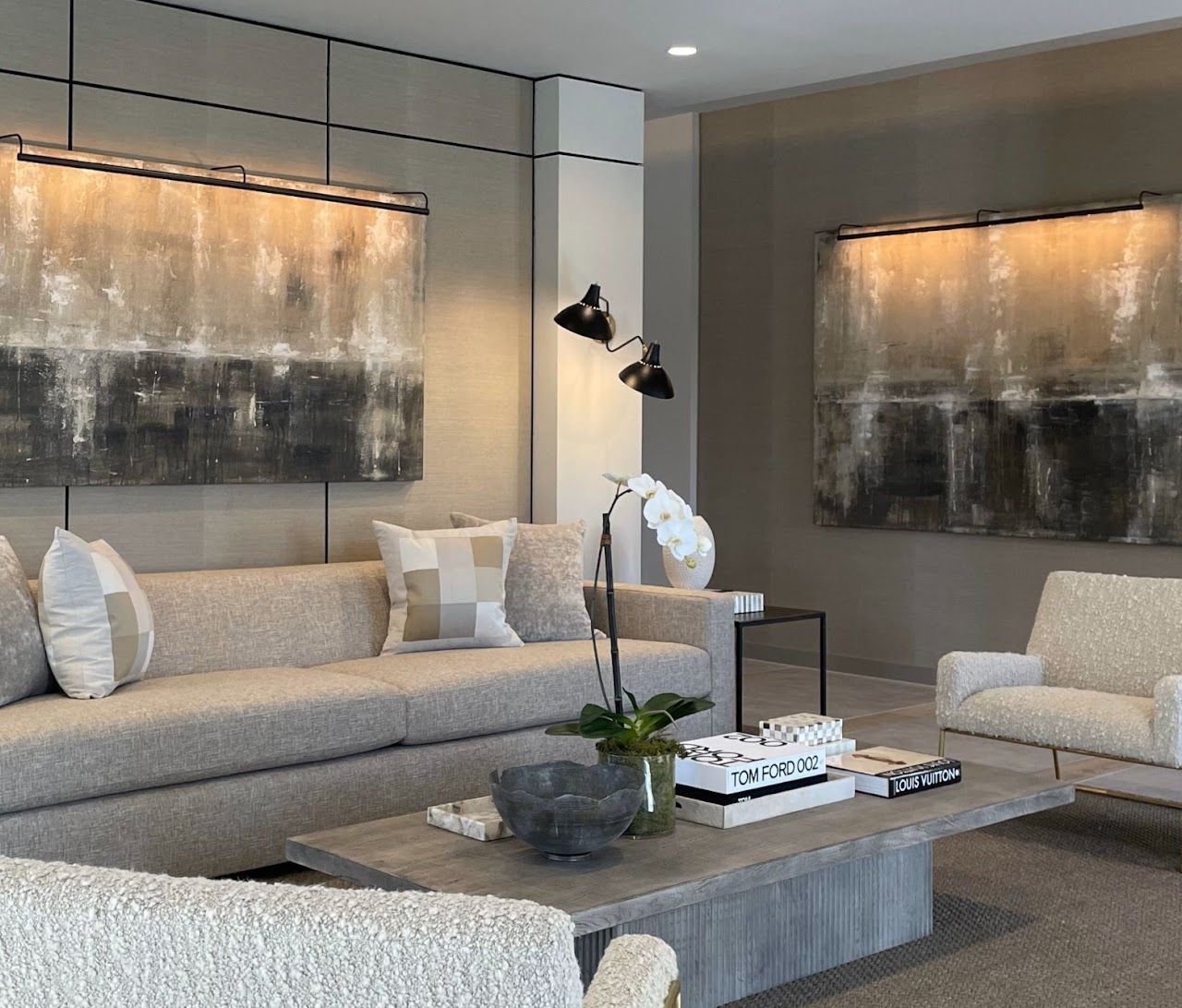 Two amber abstract paintings by Joanna Purvis in a living room