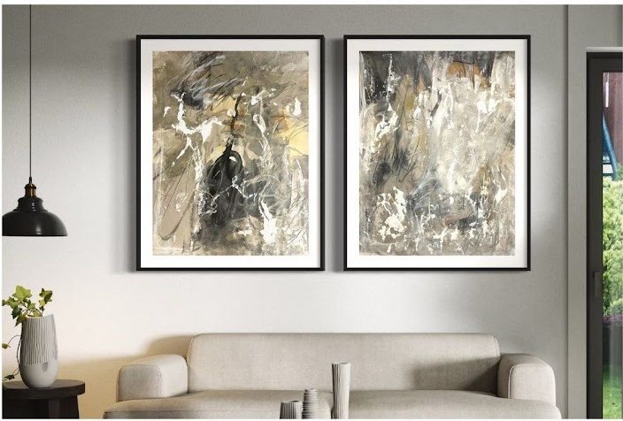 Two abstract paintings by Joanna Purvis framed above a sofa
